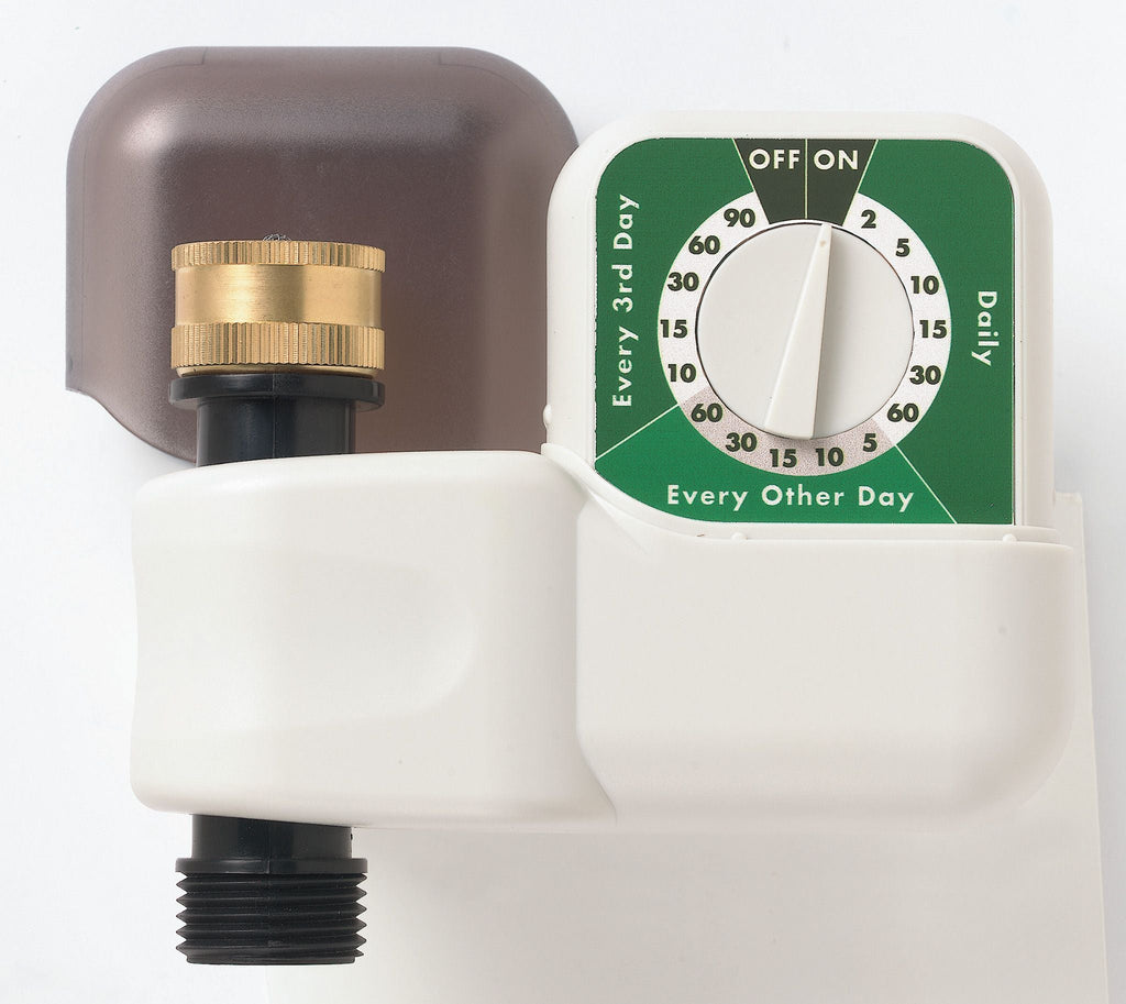 A white automatic hose faucet timer attached to a gold-colored garden hose, with a single dial for setting watering frequencies.