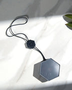Top view of a B-yve smart flood sensor.