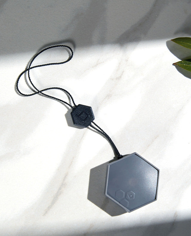 Top view of a B-yve smart flood sensor.